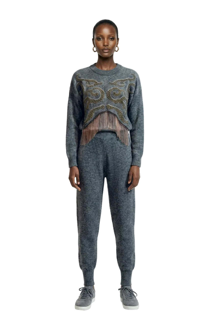 Grey knit set with beaded sweater and tapered pants.